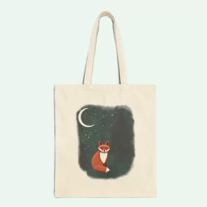 A serene red fox basks in the glow of the moon and stars in this mystical winter tote bag. A dreamy, nature-inspired carryall for fox and forest lovers!