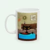 Mid-century modern mug with black cat playing records on a vintage turntable in a retro living room