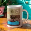Mid-century modern mug with black cat playing records on a vintage turntable in a retro living room