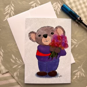 Bear bouquet greeting card by Tom Serafini displayed on a green leaf background with white envelope